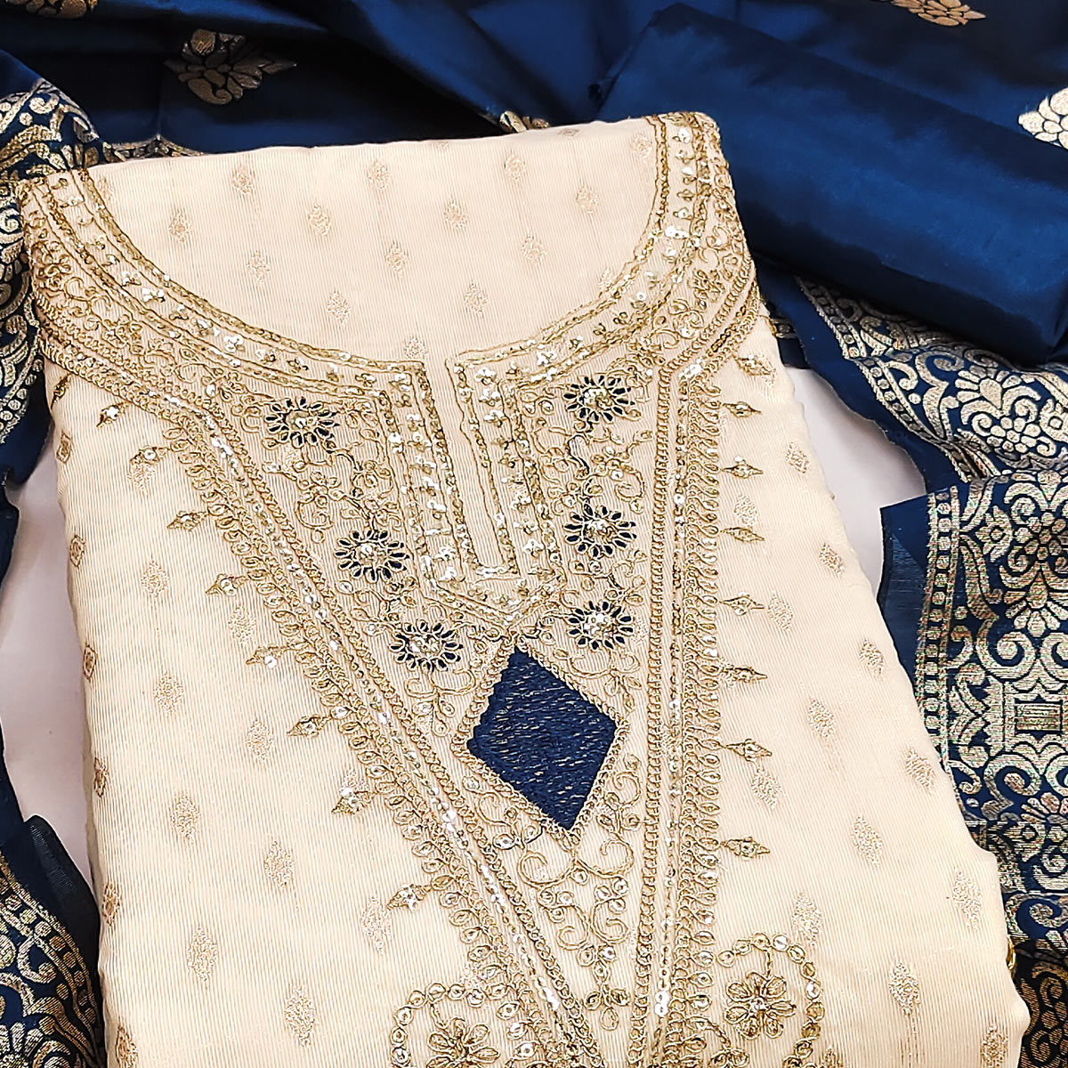 Cream & Blue Floral Butti Weaving With Intricate Cording Embroidered Shimmer Dress Material